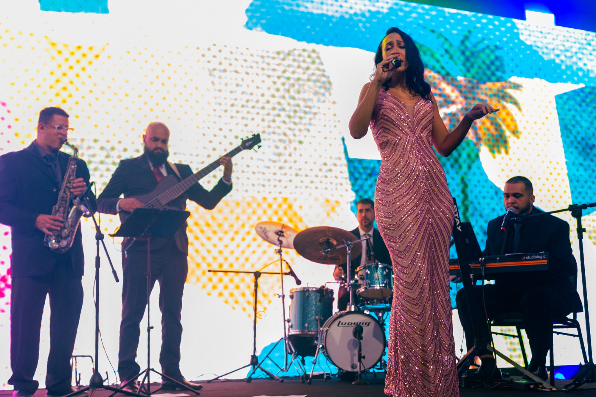 Sunset Jazz vocalist singing live with the band at a high-end event